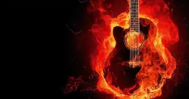 A burning guitar symbolizing passion for music, engulfed in flames against a black backdrop. "Musica è amore" - Music is love.