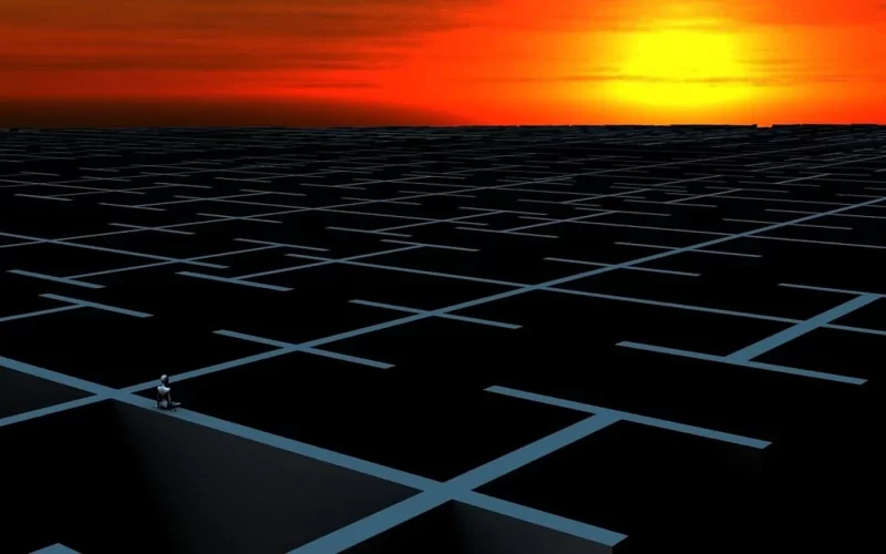 Image of a computer-generated maze with a sunset in the background, symbolizing longing and the desire to break free from the cycle of existence.