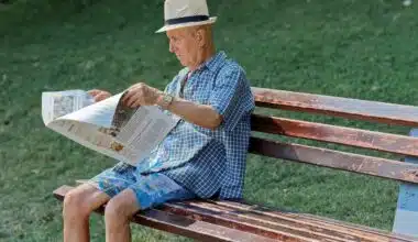 Man reading news paper for the latest news. Read about the Scandal in Bogotá