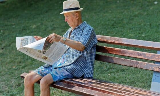 Man reading news paper for the latest news. Read about the Scandal in Bogotá