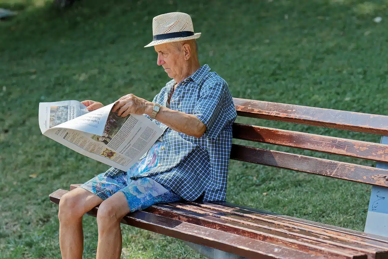 Man reading news paper for the latest news. Read about the Scandal in Bogotá