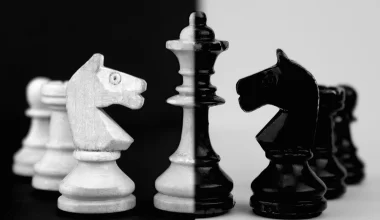 Image of a black and what chess set symbolizing the manipulation and mind games at play in Part 6 of the Bloody Tulip Short Story Series "Twisted Intentions"