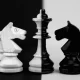 Image of a black and what chess set symbolizing the manipulation and mind games at play in Part 6 of the Bloody Tulip Short Story Series "Twisted Intentions"