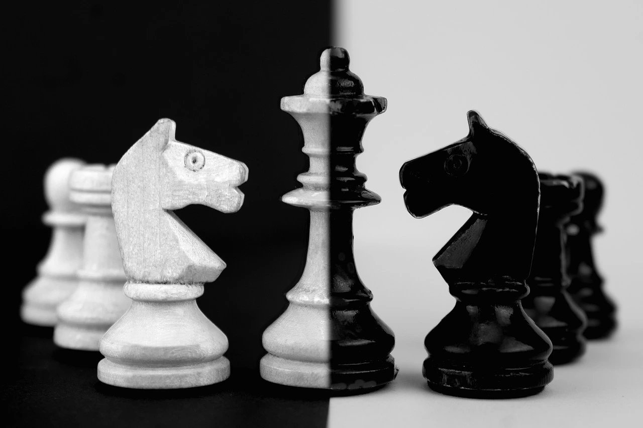 Image of a black and what chess set symbolizing the manipulation and mind games at play in Part 6 of the Bloody Tulip Short Story Series "Twisted Intentions"