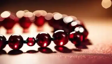 Image of a beaded bracelet with red beads like droplets of blood. This bracelet fits into the narrative of the serial killer thriller Dancing with Darkness: The Bloody Tulip - Part 16