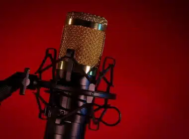 Professional podcast microphone against dramatic red background - Soulcraze Unscripted dark fiction and talk show podcast